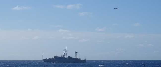 A Coast Guard HC-130 Hercules airplane crew from Air Station Barbers Point monitors a Russian military vessel approximately 15 nautical miles south of Oahu Oct. 29, 2025. Coast Guard personnel are monitoring the vessel’s activities near U.S. territorial waters, which extend to 12 miles offshore. (U.S. Coast Guard photo, courtesy Cutter William Hart) U.S. Coast Guard responds to Russian military vessel off Honolulu