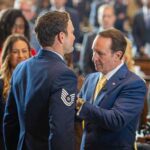 Louisiana Gov. Jeff Landry pins the Distinguished Flying Cross on Tech. Sgt. Adam Brister during a March 26, 2026, ceremony at the Louisiana Capitol Building in Baton Rouge. Brister earned the award as an Alaska Air National Guardsmen with the 212th Rescue Squadron for an act of valor during a June 23, 2018, rescue in the Neacola Mountain Range of Alaska. (Photo courtesy of the Louisiana Department of Veterans Affairs)