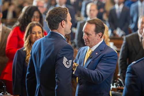 Louisiana Gov. Jeff Landry pins the Distinguished Flying Cross on Tech. Sgt. Adam Brister during a March 26, 2026, ceremony at the Louisiana Capitol Building in Baton Rouge. Brister earned the award as an Alaska Air National Guardsmen with the 212th Rescue Squadron for an act of valor during a June 23, 2018, rescue in the Neacola Mountain Range of Alaska. (Photo courtesy of the Louisiana Department of Veterans Affairs)