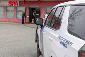 An Alaska State Trooper patrol vehicle is parked outside Jasmine Spa during a search warrant service. Courtesy: Alaska State Troopers
