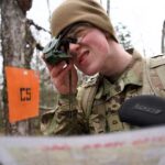 Army ROTC Cadet Jake Thacker, a student at the University of Alaska Anchorage, navigates during an April 16 land navigation course at Alcantra National Guard Armory Complex. Thacker earned and is using a Guaranteed Reserve Forces Duty Minuteman Scholarship to pay for college. (Alaska National Guard photo by David Bedard)
