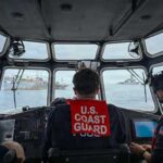 A U.S. Coast Guard long-range interceptor boatcrew from the Legend-class cutter Midgett (WMSL 757) monitors boarding team members conducting a law enforcement boarding of a fishing vessel. (U.S. Coast Guard Photo by Petty Officer 3rd Class Austin Wiley)