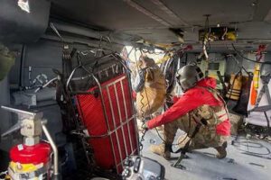 A G Company, 2-211th General Support Aviation Battalion, HH-60M Black Hawk crew chief hoists a hiker stranded on Matanuska Peak July 2, 2026. The rescue required the hoist-capable helicopter due to the vertical terrain. (Courtesy photo)
