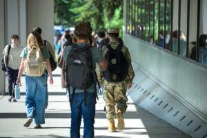 Students walk past the Administration/Humanities Building during the first week of UAA's fall 2026 semester. (Photo by James Evans / University of Alaska Anchorage)