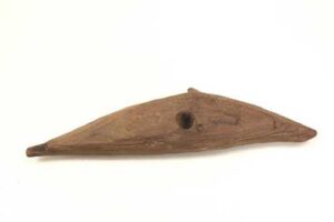 Photo: Porpoise target piece carved of bark, Malina Creek site, Afognak Native Corporation collection. AM24.