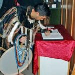 Guest-Alutiiq Word of the Week Photo: A visitor signed the guestbook at the Alutiiq Museum, May, 2008.