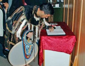Photo:  A visitor signed the guestbook at the Alutiiq Museum, May, 2008.
