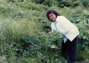 Photo: Mary Haakanson gathering angelica, Old Harbor, June 1990. Kodiak Area Native Association Collection, AM4:128.
