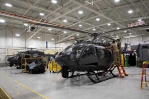 Alaska Army National Guard Staff Sgt. Jonathan Holston, left, and Spc. Hannah Kinder, UH-72A Lakota light utility helicopter crew chiefs assigned to the 207th Aviation Troop Command, perform engine maintenance at Bryant Army Airfield on Joint Base Elmendorf-Richardson,. (Alaska National Guard photo by Alejandro Peña)