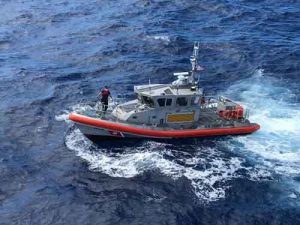 A 45-foot Response Boat-Medium boatcrew from Coast Guard Station Honolulu are shown conducting a search for five crewmembers aboard a downed Army UH-60 Black Hawk helicopter approximately two miles west of Ka’ena Point, Oahu.(U.S. Coast Guard photo/Released)