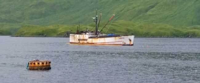 The fishing vessel Akutan in Captains Bay near Unalaska. A unified command was established to mitigate potential pollution and environmental impact from the vessel. U.S. Coast Guard photo