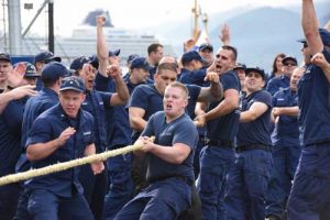 Crewmembers of the Coast Guard Cutter Hickory, homeported in Homer, Alaska, celebrate after winning the tug-o-war competition during the Buoy Tender Roundup Olympics at Coast Guard Station Juneau, Alaska, Aug. 17, 2016. Image-U.S. Coast Guard photo by Petty Officer 2nd Class Jon-Paul Rios