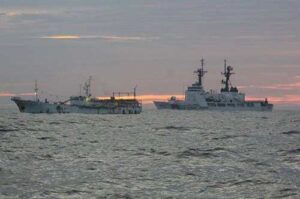 Coast Guard Cutter Munro interdicts an illegal drift net fishing vessel in the North Pacific. Image-USCG