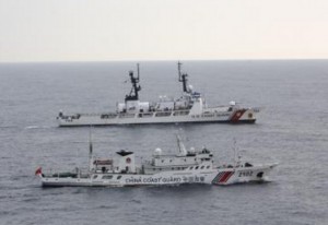 The Coast Guard Cutter Morgenthau and China coast guard vessel 2102 steam alongside each other during the transfer of the fishing vessel Yin Yuan in the North Pacific Ocean June 3, 2014. The Morgenthau crew was patrolling in support of Operation North Pacific Guard, the Coast Guard's component of a multi-lateral fisheries law enforcement operation designed to detect and deter illegal, unreported and unregulated fishing activity. (U.S. Coast Guard photo by Coast Guard Cutter Morgenthau)
