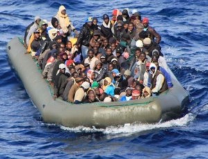 Migrants await rescue by Italian ships in February.