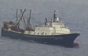 The catcher-processor Alaska Juris can be seen visibly listing as it is taking on water. Crewmembers in raft can be seen floating at the bow. Image-Screengrab of USCG video taken by Petty Officer 1st Class Kelly Parker