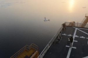 OAST GUARD CUTTER HEALY, Arctic Ocean – Coast Guard and National Oceanic and Atmospheric Administration researchers successfully landed an unmanned aircraft system on the flight deck of Coast Guard Cutter Healy Monday, marking the first time a UAS has completed a take-off and landing aboard a Coast Guard icebreaker.  UAS operators from AeroVironment, designers of the Puma All Environment UAS, working alongside researchers from the Coast Guard Research and Development Center and NOAA made necessary adjustments following several unsuccessful attempts to land the Puma AE on the icebreaker’s flight deck. High winds, heavy fog, and icing conditions delayed further attempts until Monday night when skies cleared enough for another attempt. UAS operators came close to landing the system on the initial attempt before managing three successful landings. The last was a perfect landing onto the center of the flight deck.  Researchers and crew aboard the Healy left Seward, Alaska, Aug. 8 to conduct testing of the Puma AE and other technologies for use as oil spill tracking tools. The UAS is equipped with an electro-optical and infrared camera plus illuminator on a lightweight mechanical gimbaled payload allowing its operator to keep constant watch over the device’s target.  The Coast Guard RDC and NOAA hope to utilize UAS and other unmanned technologies to perform monitoring and search operations in the Arctic and other areas where hazardous conditions might otherwise place human observers in increased danger.  “The Coast Guard and its partners realize the value of exploring technologies like UAS to improve our ability to respond in the Arctic,” said Rich Hansen, RDC Chief Scientist traveling aboard Healy. “Unmanned systems have great potential for tracking spills, so responders can avoid unnecessary risk while safeguarding our seas.”  The Coast Guard Research and Development Center is based in New London, Conn., and aids the Coast Guard by providing research and evaluations of technologies and equipment with the potential for enhancing its ability to carry out its missions.  Coast Guard Cutter Healy is a 420-foot icebreaker homeported in Seattle, Wash. The icebreaker’s crew conducts the Coast Guard’s traditional missions including search and rescue, environmental protection and enforcement of laws and treaties while performing their primary mission of assisting with scientific research in polar regions. Coast Guard photo by Petty Officer 1st Class Shawn Eggert.