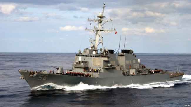 The guided missile destroyer USS John S. McCain approaches the USS Kitty Hawk in this 2003 photo. Image-USDoD