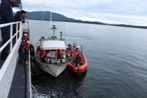 A Coast Guard small-boat crew transfers tow of the 36-foot vessel Viking Queen to the Cutter John McCormick in Elena Bay, 50 miles southwest of Kake. USCG photo