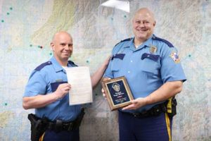 Colonel Doug Massie (left) presenting Trooper Steven Cantine with 2021 Alaska Wildlife Trooper of the Year Award. Image-DPS
