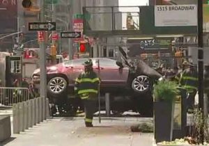 The burgundy Honda involved in the Times Square vehicle-pedestrian incident came to rest on the steel barricades near Planet Hollywood.