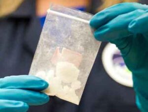 A bag of 4-fluoro isobutyryl fentanyl, which was seized in a drug raid, is displayed at the Drug Enforcement Administration (DEA) Special Testing and Research Laboratory in Sterling, Virginia. Image-DEA