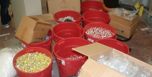 Several large buckets of anabolic steroid vials confiscated during an earlier DEA raid. Image-DEA