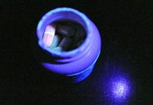 The phony pill sent to Le glows under ultraviolet light, just as real ricin would. Image-FBI