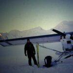 Photo by Martin Stuefer Keith Echelmeyer stands by his plane on Black Rapids Glacier in 2001.