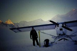 Photo by Martin Stuefer
Keith Echelmeyer stands by his plane on Black Rapids Glacier in 2001.