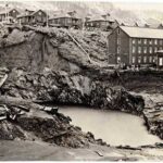 This photo taken April 22, 1917, shows a massive sinkhole that opened up as the Treadwell Mines collapsed and filled with seawater. (Photo courtesy Alaska State Library, from the Harry F. Snyder Photograph Collection)