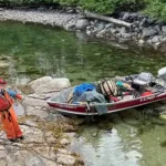 The Fosses’ son Max with a skiff full of debris. Photo courtesy Jacquie Foss.