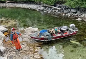 The Fosses’ son Max with a skiff full of debris. Photo courtesy Jacquie Foss.