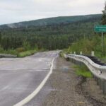 UAF photo by Sam Bishop Ballaine Road exhibits bumps from permafrost thawing near where it crosses Goldstream Creek north of Fairbanks in July 2026.