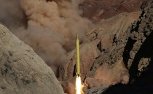 In this photo obtained from the Iranian Fars News Agency, a Qadr H long-range ballistic surface-to-surface missile is fired by Iran's Revolutionary Guard, during a maneuver, in an undisclosed location in Iran, Wednesday, March 9, 2016.