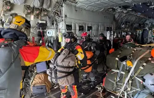 Guardian Angels of 212th Rescue Squadron stand by to jump from a 211th Rescue Squadron HC-130J Combat King II during an Aug. 8, 2025, rescue mission in the North Pacific Ocean. The Guardian Angels carried the necessary equipment to treat a critically ill patient aboard a South Korean fishing vessel. (Courtesy photo) Alaska Air National Guard combat rescue officer recalls rescue jump in the north Pacific