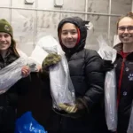 Terese Vicente, Annie Masterman and Robin Masterman pack up salmon for distribution through the ex-Typhoon Halong traditional foods drive. Photo by Katie Basile/Alaska Sea Grant.