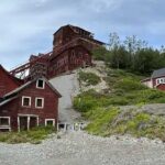 Photo by Rod Boyce The towering Kennecott Mines copper mill sits on a mountainside in Wrangell-St. Elias National Park and Preserve. The mill processed ore from the company’s Bonanza, Jumbo, Mother Lode, Erie and Glacier mines. The restored mine office is at right.