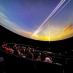 Photo by Eric Marshall A UAF audience and guests enjoy a pre-opening movie screening March 31 in the new Walt and Marita Babula Planetarium.