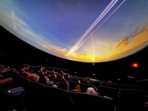 Photo by Eric Marshall
A UAF audience and guests enjoy a pre-opening movie screening March 31 in the new Walt and Marita Babula Planetarium.