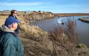 Davin Holen and Roy Atchak above the Ninglikfak River in Chevak. Atchak is First Chief of the Chevak Native Village as well as president of the Chevak Company Corporation. Photo by E. Lance Howe.
