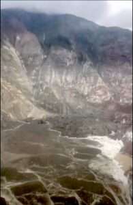 Image from video by Lt. Chip Baucom and Cmdr. PJ Johansen, U.S. Coast Guard.
A landslide in Southeast Alaska spilled into Tracy Arm and onto South Sawyer Glacier on Aug. 10. Dirt, rock and debris in the lower left part of the image have replaced the fjord’s water.