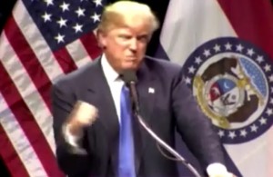 Trump reacting after a protester rushed the stage at a rally. Image-Screenshot/VOA
