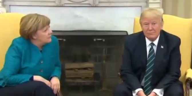 During their brief joint appearance in front of cameras and reporters, President Trump ignored requests from the press and Germany's Leader, Angela Merkel to shake hands. Image MSNBC video screengrab.