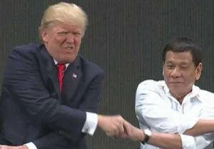 Presidents Trump and Duterte in a complicated handshake. Image-Screenshot/CBS