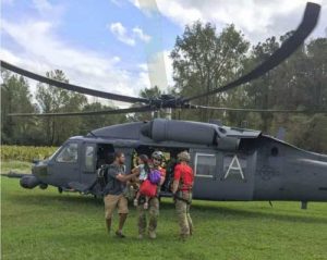 Courtesy Photo | Alaska Air National Guardsmen from the 176th Wing’s 212th Rescue Squadron assist with recovering isolated flood survivors via a California ANG’s 129th Wing HH-60 Pavehawk helicopter crewed by members of the 210th RQS near Sampson County, N.C., Sept. 17