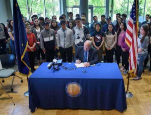 Governor Bill Walker signs S.B. 26, H.B. 286, H.B. 285, and S.B. 142 in the ANSEP building on the UAA campus in Anchorage,  June 13. David Lienemann/Office of Governor Bill Walker. 