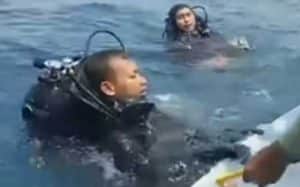 Divers with the Indonesian Navy retrieve black box from wreckage of Lion Air flight. Image-YouTube