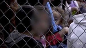 Children locked up in holding pens at border facility. Image-VOA