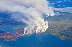 In 2014, megafires in Canada’s Northwest Territories scorched more than 7 million acres of forest, releasing half as much carbon back into the atmosphere as all the plants and trees in Canada typically absorb in an entire year. Credits: NASA/Peter Griffith
